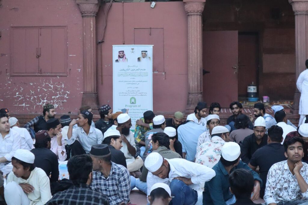 A massive gathering of fasting Muslims prepares to break the fast at Jama Masjid during the Saudi iftar programme in New Delhi during Ramzan.