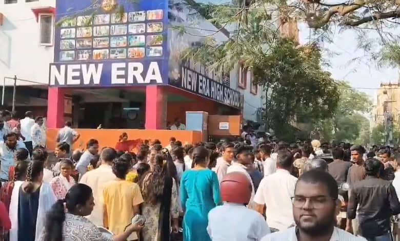 Students and parents gather outside Hyderabad school during Class 10 exams, highlighting exam day activit.