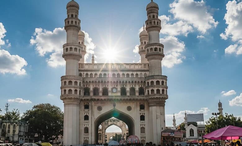 Charminar in Hyderabad with clear sky and sunlight, showcasing the historic monument during summer.