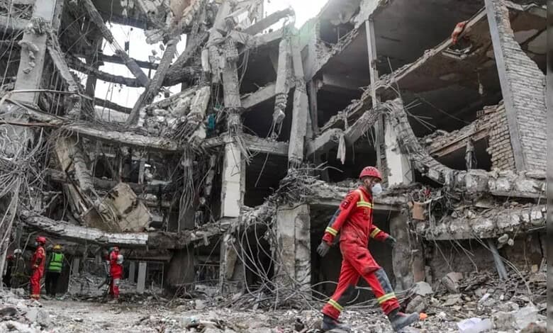 Explosion aftermath in Oman, rescue workers at site.