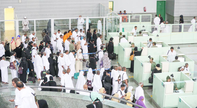 Umrah pilgrims queue at departure counters at King Abdulaziz International Airport in Jeddah.
