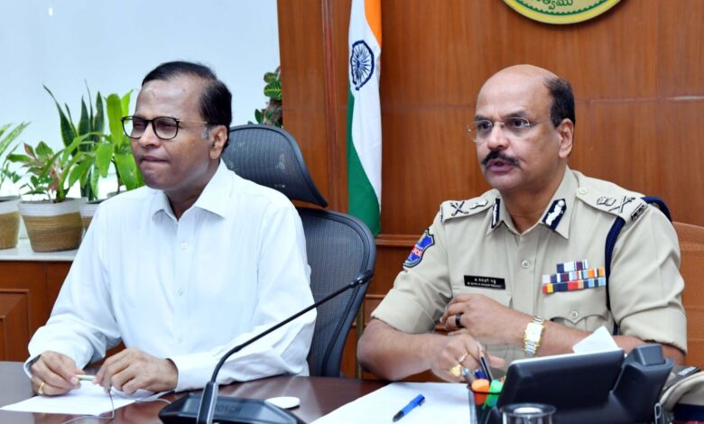 The image shows Telangana chief Secretary K Ramakrishna Rao and DGP B Shivadhar Reddy holding a review of the Arrive Alive programme being held in the state from April 13 to 18.