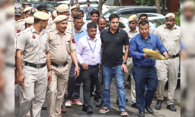 An Assam Police team and others leave the Delhi residence of Congress leader Pawan Khera after questioning in connection with a case linked to allegations made against Assam Chief Minister Himanta Biswa Sarma and his family, in New Delhi, on Tuesday, April 7.