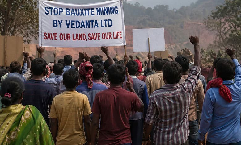 Protesters gather against Vedanta Ltd's bauxite mining, holding banners to protect land and environment i.