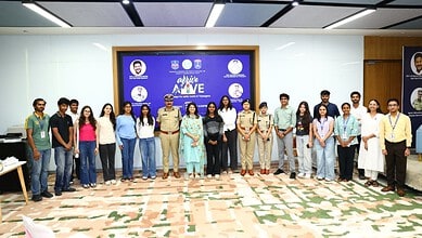 Group of young professionals and police officers standing together at a corporate event in a modern confe.