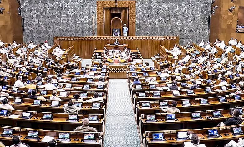 Parliament session with MPs discussing the Constitution amendment bill amid protests.