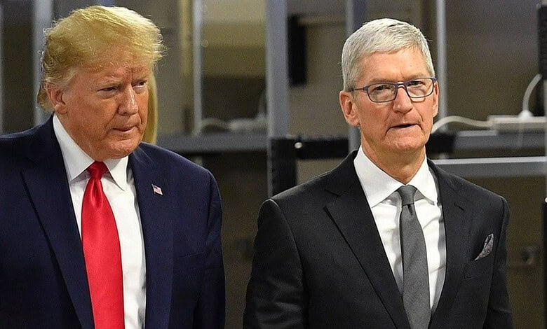 Donald Trump and Tim Cook standing together at a formal event.