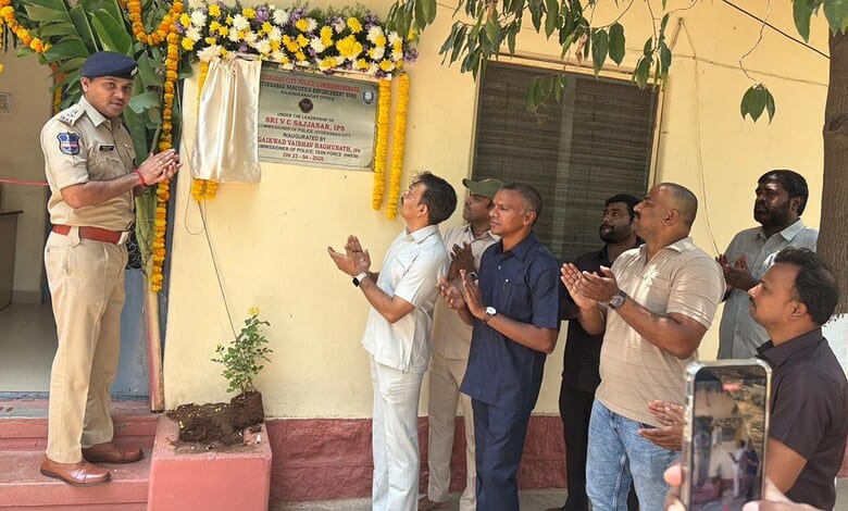 Police officer unveiling a plaque during a ceremony in Hyderabad.
