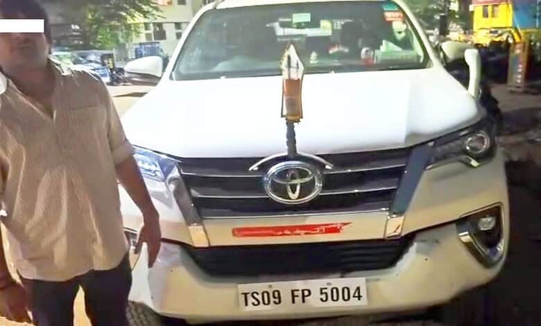 Man using siren and VIP stickers on private SUV in Hyderabad.