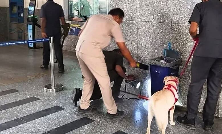 People inspecting suspicious object at Hyderabad metro station, officials and security personnel present at Uppal Metro station in Hyderabad
