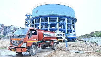 Water tanker truck delivering water at HMWSSB water treatment plant.