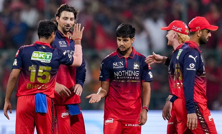 Royal Challengers Bangalore pace bowlers celebrating during IPL 2026 match against LSG.