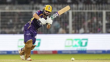 Rinku Singh in action during a cricket match for Kolkata Knight Riders, showcasing his batting skills.