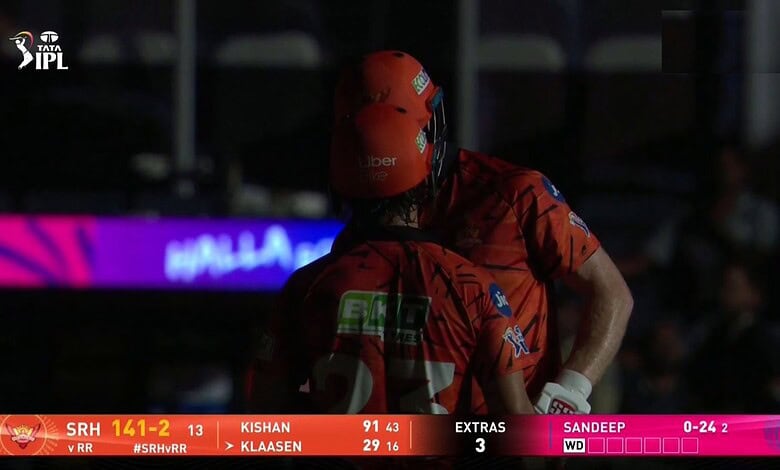 SRH vs RR cricket match at Uppal Stadium, Hyderabad, with players in action and stadium lights turned off.