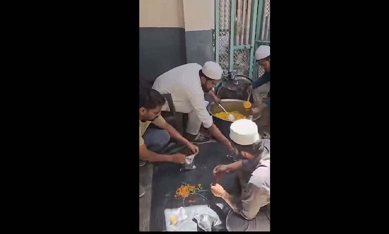 Madrasa students prepare food packets for people affected by fire