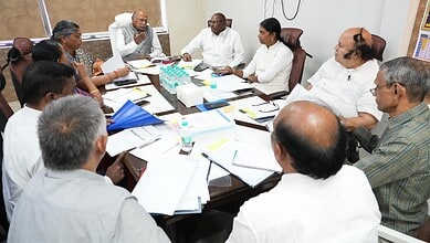 Election officials discussing voter verification and registration processes.