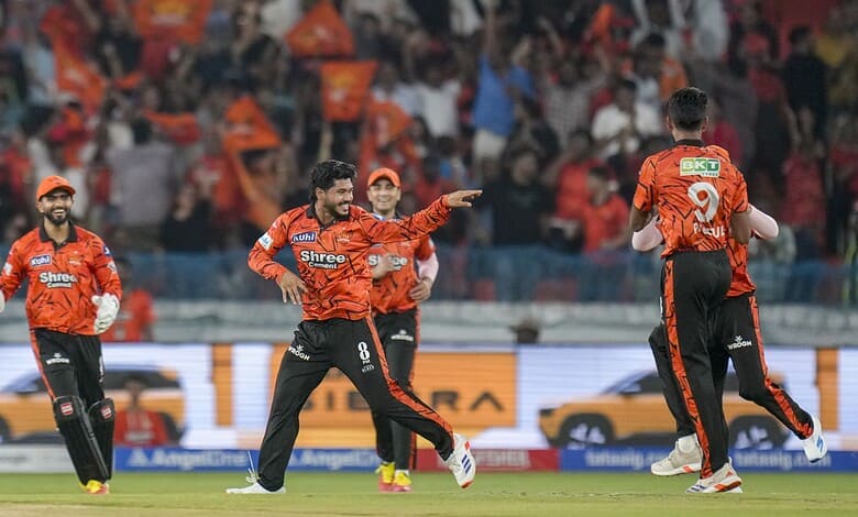 CSK players celebrating a wicket or victory in a cricket match.