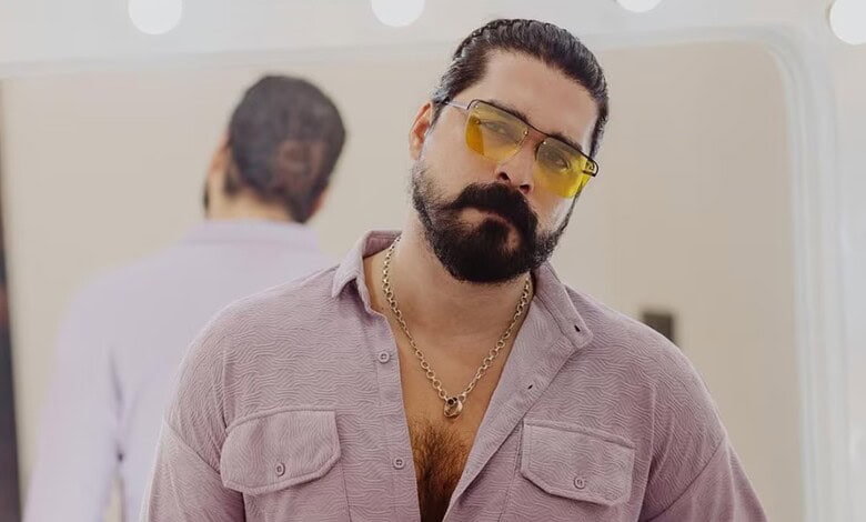 Malayalam actor Shiyas Kareem with sunglasses and beard, facing legal issues.