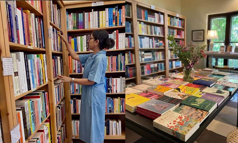 Women selecting books in a Hyderabad library, highlighting women's interest in reading.