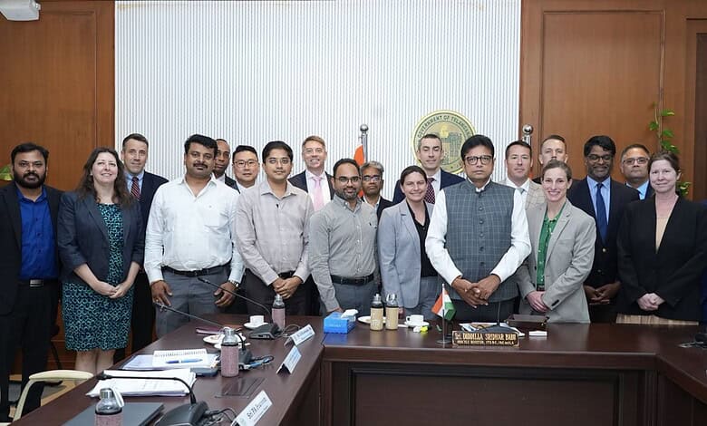 Group of officials and business leaders at a formal meeting in Telangana discussing aerospace sector inve.
