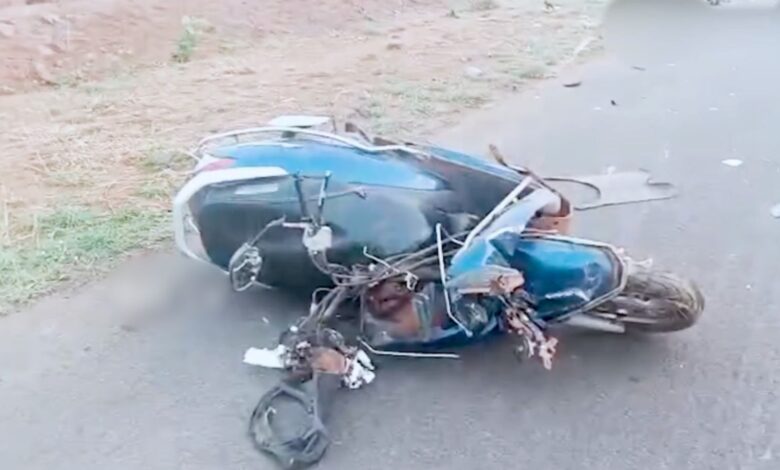 A two-wheeler mangled in the accident in Vikarabad