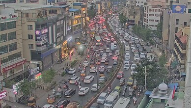 City traffic jam with numerous vehicles on crowded city street.