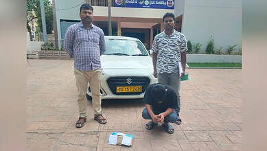 Rajasthani man detained by police in Sangareddy for drug smuggling, with officers and seized packages vis.