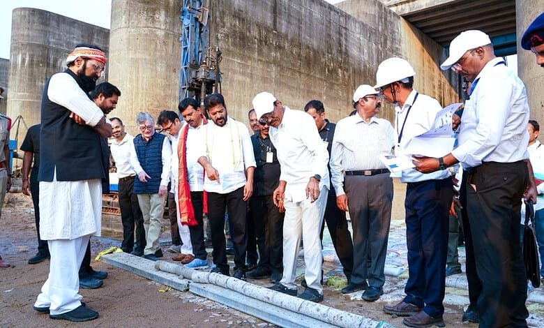 Group of politicians and officials discussing at the Kaleshwaram project site, highlighting political ten.