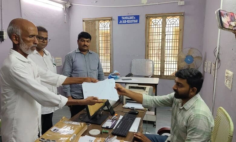A farmer receives survey map in Khammam