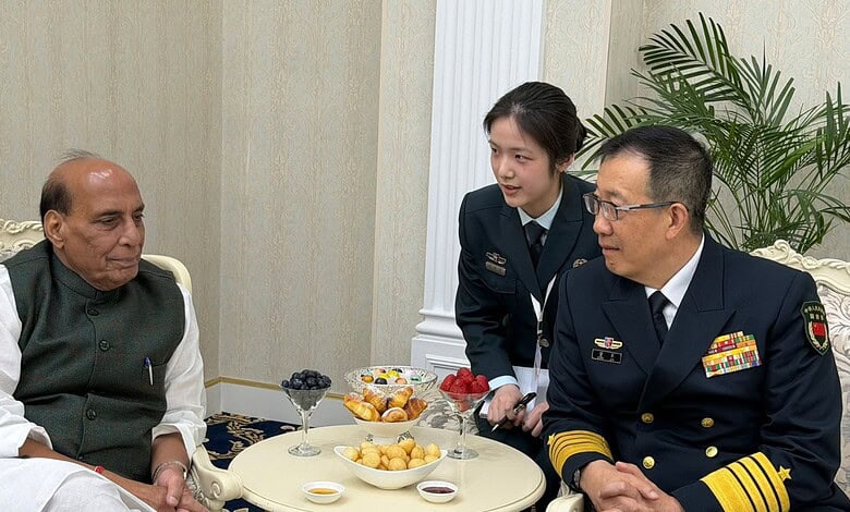 Rajnath Singh, Indian Defence Minister, in discussion with Chinese military official during bilateral tal.