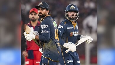 Gujarat Titans players celebrating after winning the match against Royal Challengers Bengaluru.