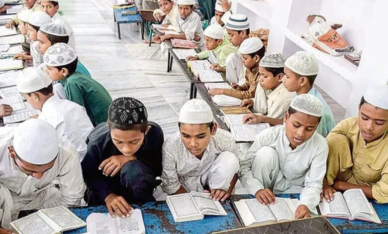 Muslim boys in traditional attire studying religious texts in a madrasa classroom.