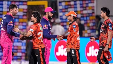 Indian and Pakistani cricket players shake hands before the match at the stadium.