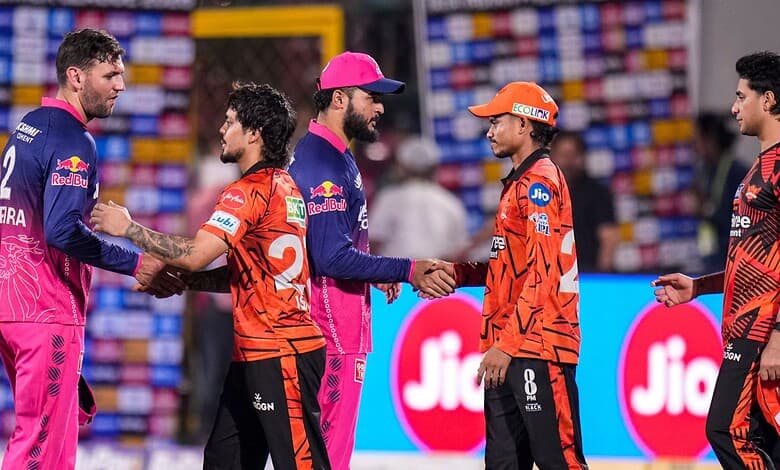 Indian and Pakistani cricket players shake hands before the match at the stadium.