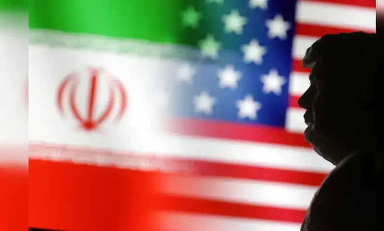 Silhouette of a person in front of Iran and US flags, highlighting rising geopolitical tensions.