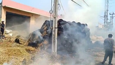 Dry grass kept for Bakrid catches fire in Shaheen Nagar, causing smoke and concern among residents.