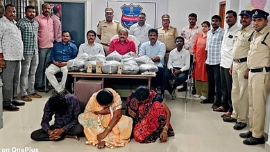 Group of police officers and civilians with confiscated items in an office setting.