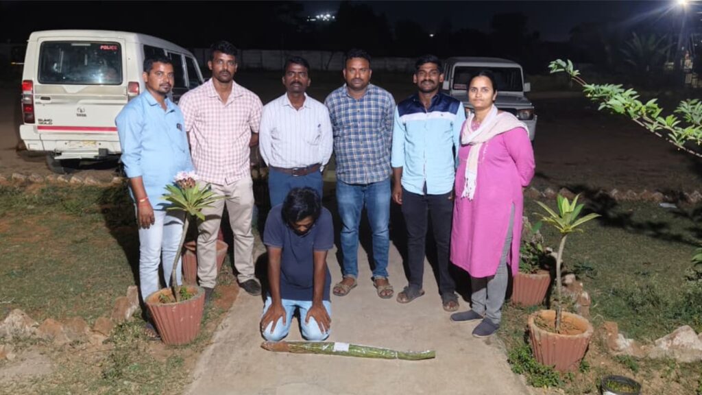 Man cultivating marijuana on terrace at night with a group of people nearby.