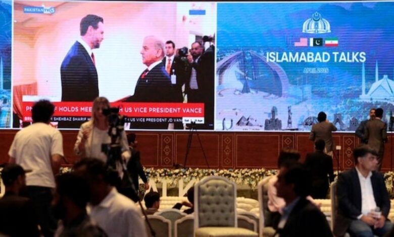 Media centre in Islamabad displaying Shehbaz Sharif and JD Vance during US–Iran talks.