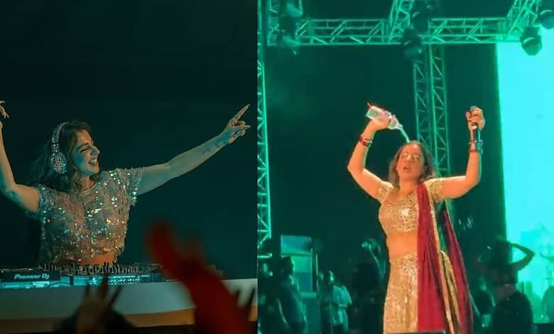 Jasmine Sandlas on stage, dancing and singing passionately during a bold concert moment. The vibrant ligh.