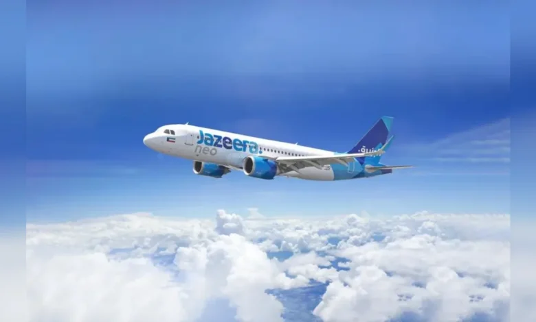 Jazeera Airways aircraft flying above clouds
