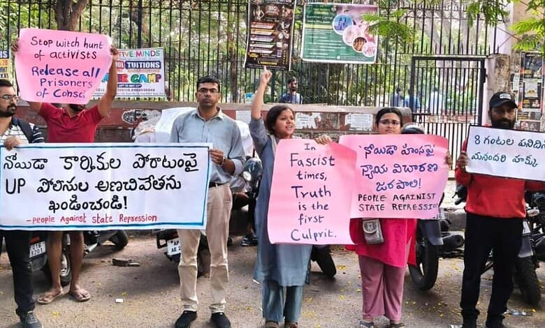 Hyderabad citizens protest for labour activists' release in Noida, holding signs against state repression.
