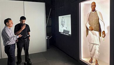 AI avatars of Gandhi and Vajpayee displayed at Delhi's PM Museum. Visitors observe the lifelike digital r.