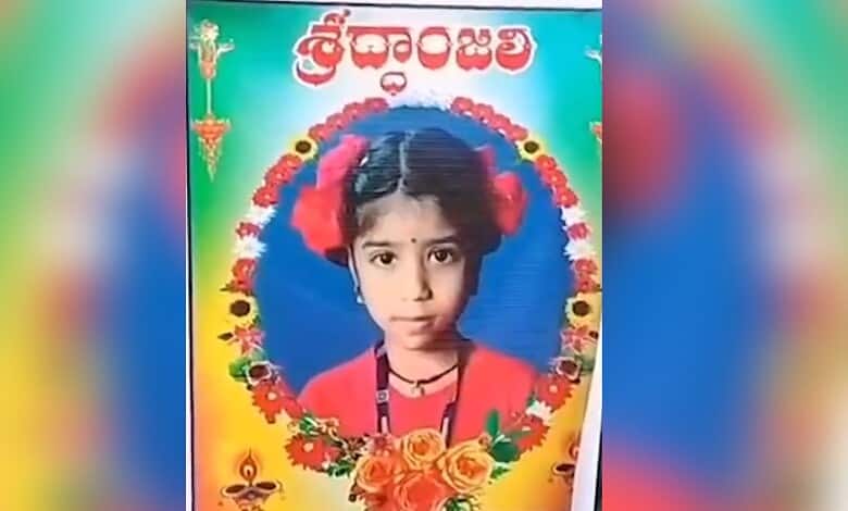 Young girl dressed in traditional attire with floral accessories, celebrating a cultural festival.