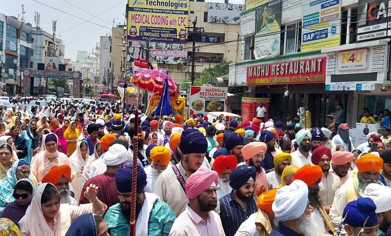 Large crowd of Sikhs celebrating Khalsa Foundation Day with devotion in Hyderabad, colourful turbans and.