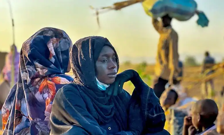 A woman in Sudan looks worried as the ongoing war causes suffering and displacement among civilians.