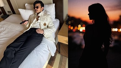 Veer Pahariya relaxing on a hotel bed, mystery girl silhouette at sunset in the background.