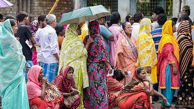 Voters waiting in line during re-polling at 15 booths in West Bengal, with a 37% turnout till 11 am.