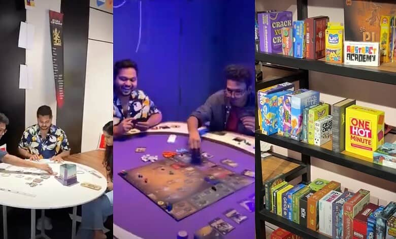 Engaging group playing board game in a modern gaming room with shelves of board games and books.