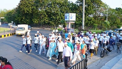 Census 2026 awareness walkathon at Necklace Road in Hyderabad with participants marching for demographic.